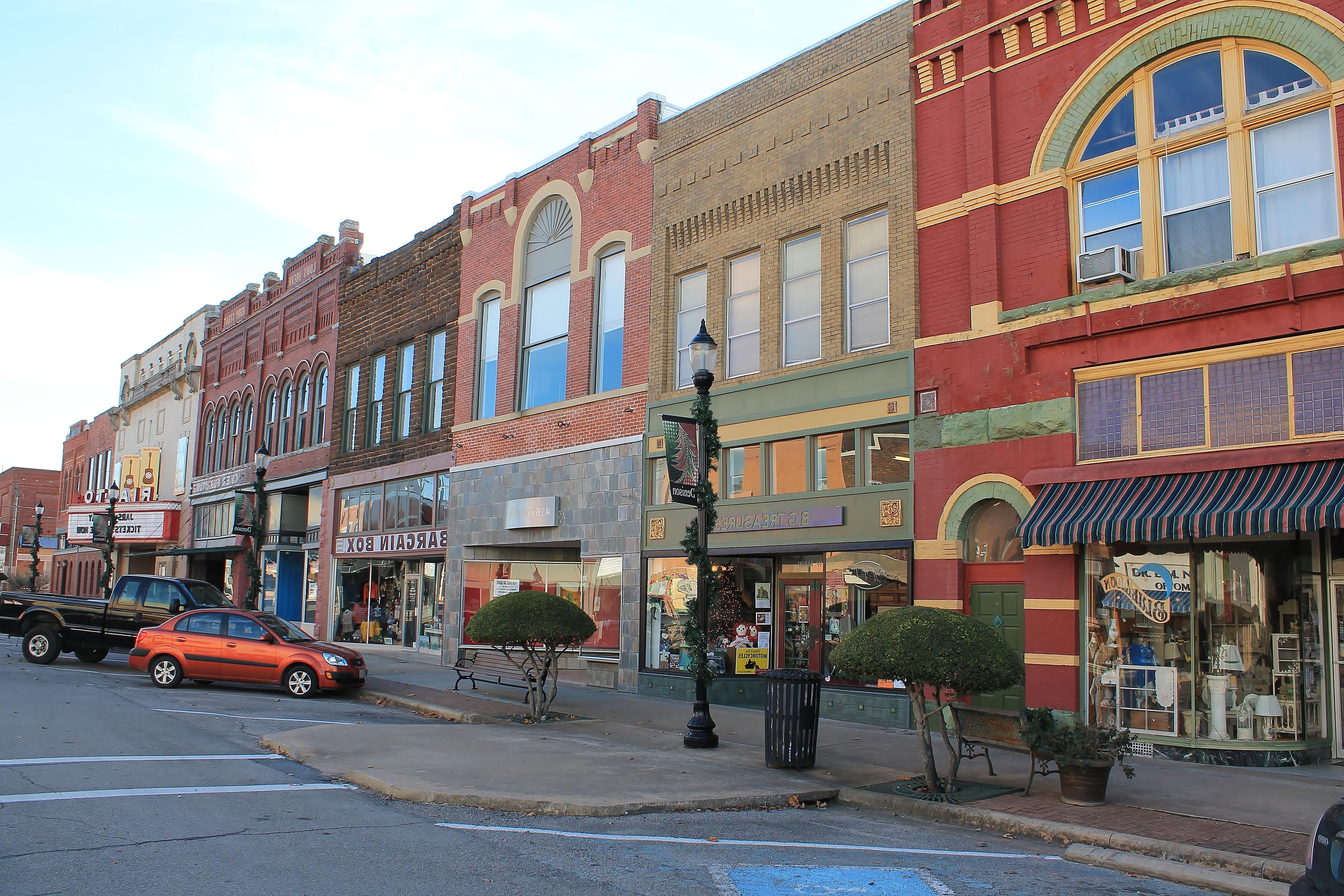View of shops and restaurants lining historic commercial street in Denison TX